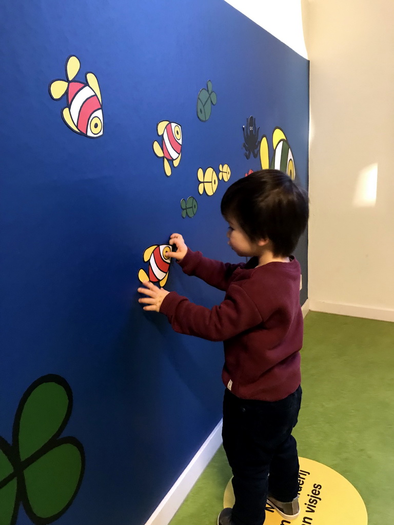 Max playing with cardboard fish at the Animal Room at the upper floor of the Nijntje Winter Museum
