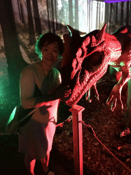 Miaomiao with a Ceratosaurus statue at the World of Dinos exhibition at the Jaarbeurs building