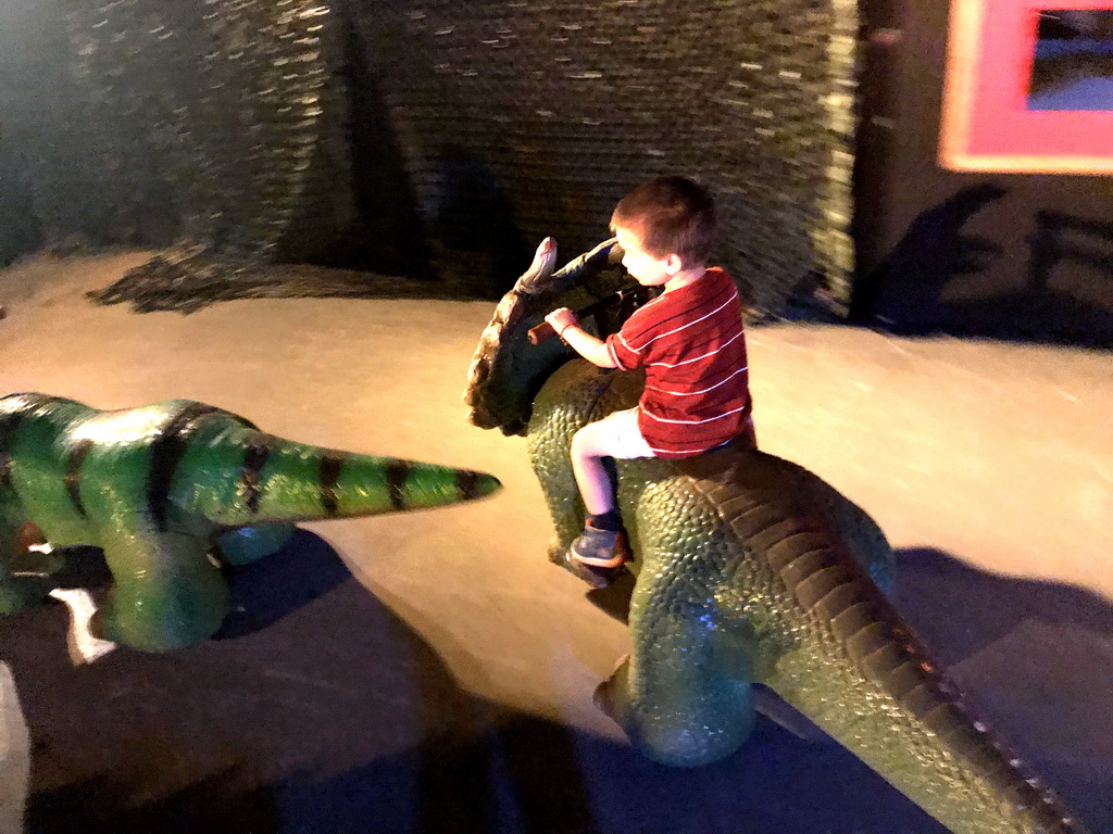 Max on a Triceratops car at the World of Dinos exhibition at the Jaarbeurs building