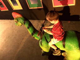 Max on a Brachiosaurus car at the World of Dinos exhibition at the Jaarbeurs building