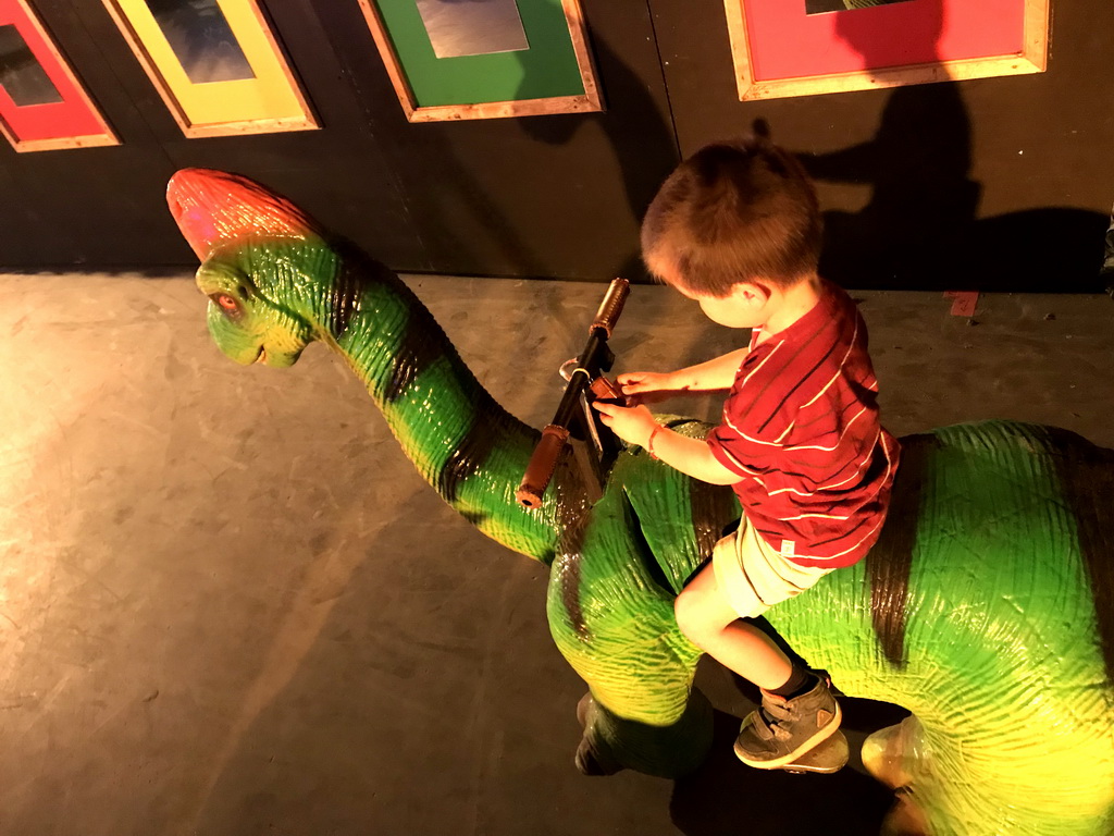 Max on a Brachiosaurus car at the World of Dinos exhibition at the Jaarbeurs building