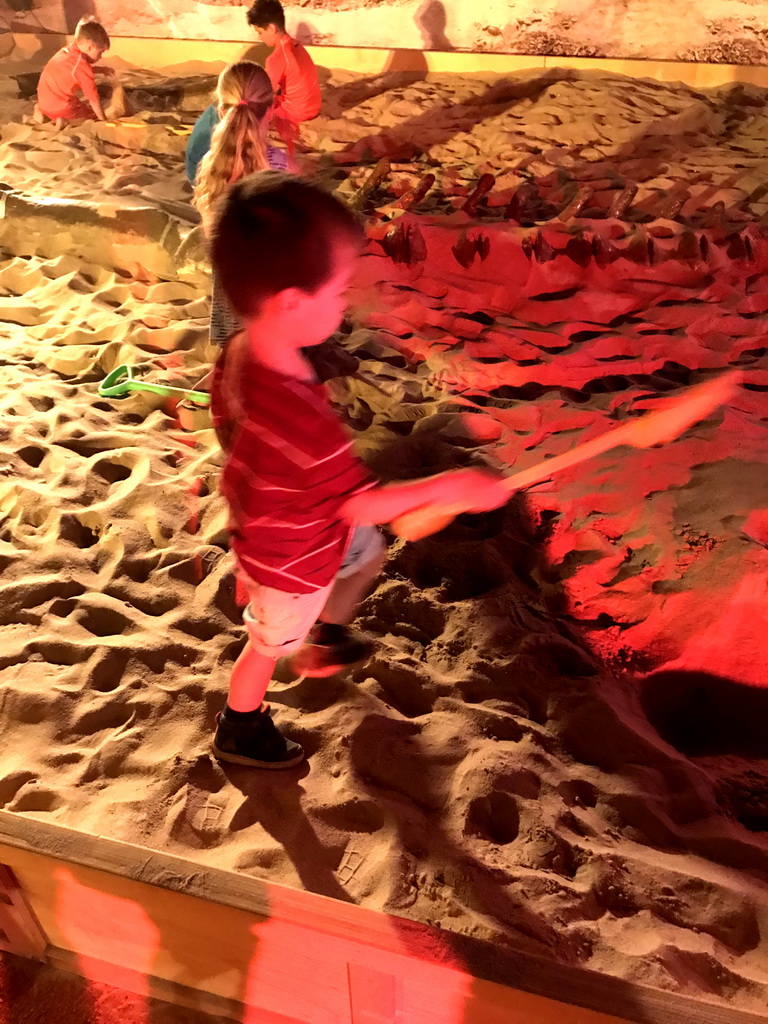 Max at the excavation playground at the World of Dinos exhibition at the Jaarbeurs building