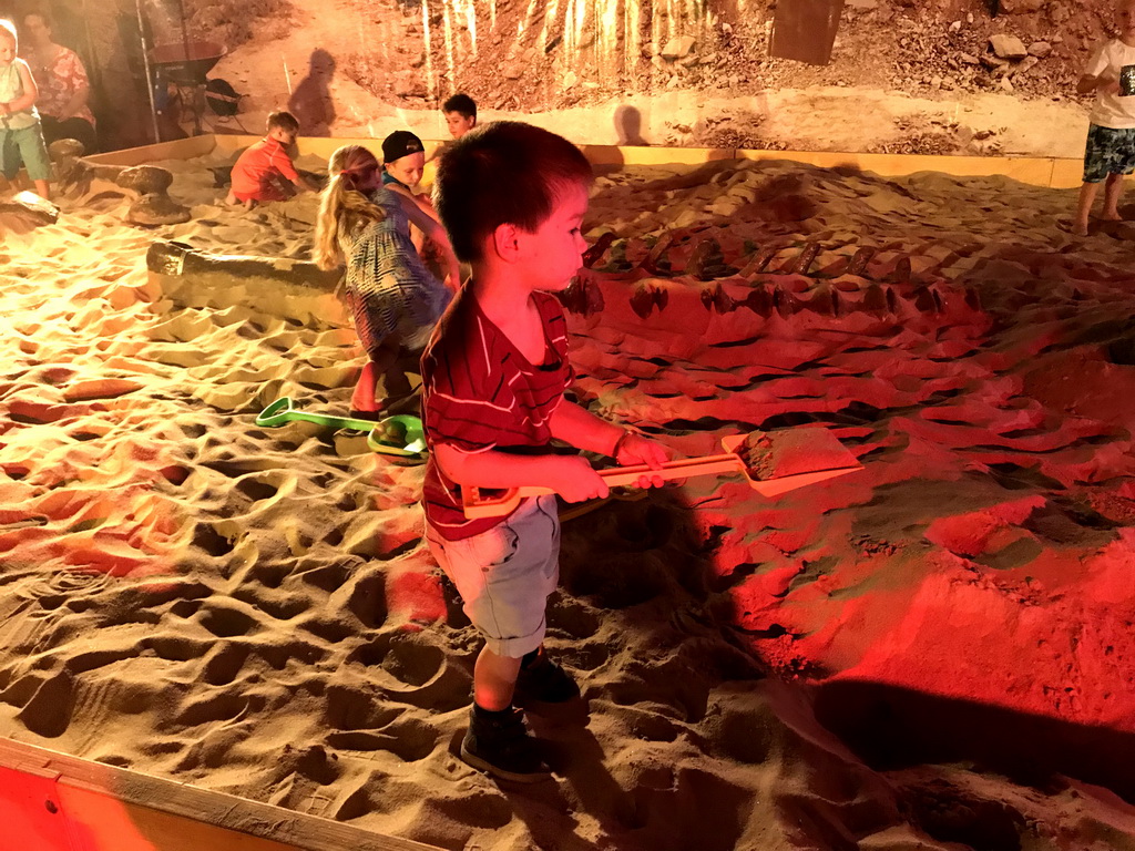 Max at the excavation playground at the World of Dinos exhibition at the Jaarbeurs building