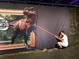 Tim and Max pretending to catch a Tyrannosaurus Rex at the World of Dinos exhibition at the Jaarbeurs building