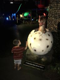 Max with a Tyrannosaurus Rex in a egg statue at the World of Dinos exhibition at the Jaarbeurs building