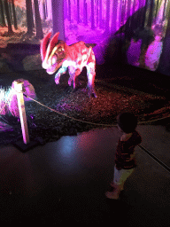 Max with a Dilophosaurus statue at the World of Dinos exhibition at the Jaarbeurs building