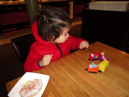 Max playing with train toys at the De Remise restaurant at the Werkplaats hall of the Spoorwegmuseum