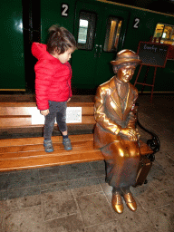 Max with a bronze statue at the `Treinen door de Tijd` exhibition at the Werkplaats hall of the Spoorwegmuseum