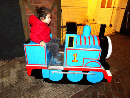 Max on the Thomas the Tank Engine rocking train in front of the De Remise restaurant at the Werkplaats hall at the Spoorwegmuseum