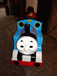 Max on the Thomas the Tank Engine rocking train in front of the De Remise restaurant at the Werkplaats hall at the Spoorwegmuseum