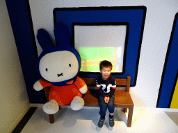 Max with a statue of Nijntje at the entrance of the Nijntje Museum