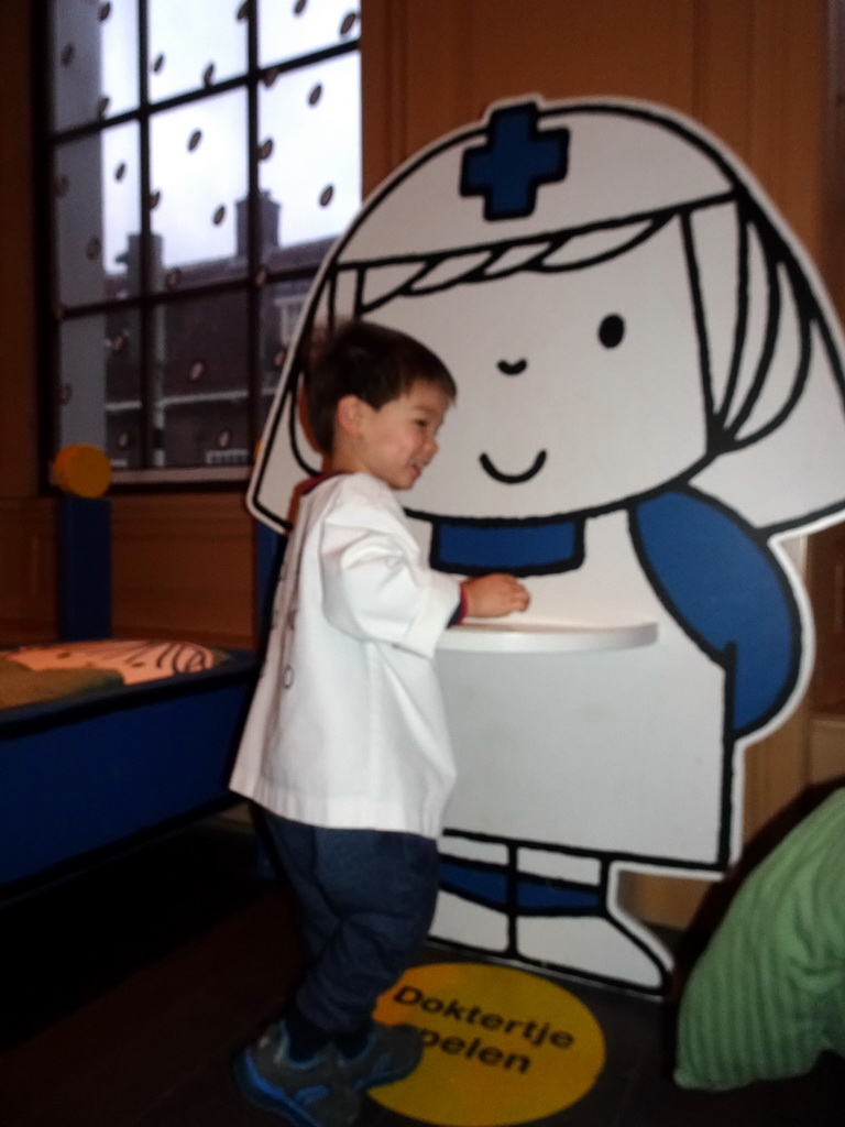 Max playing doctor at the Hospital Room at the ground floor of the Nijntje Winter Museum