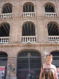 Miaomiao in front of the northwest side of the Plaza de Toros de Valencia bullring at the Carrer d`Alacant street