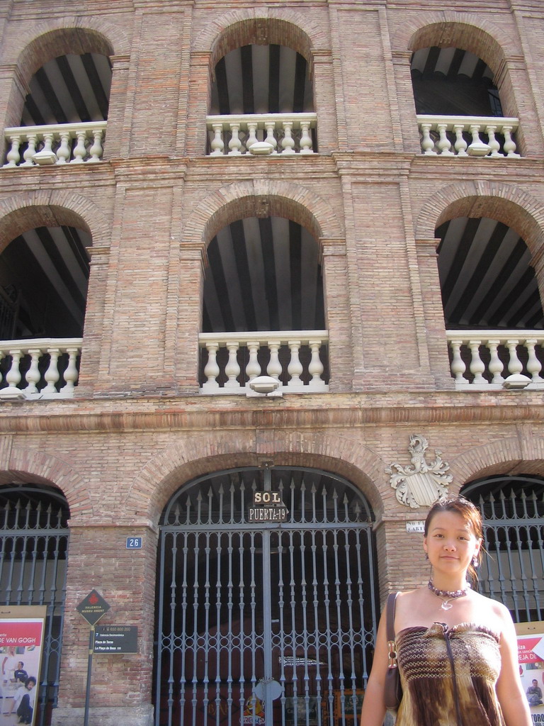 Miaomiao in front of the northwest side of the Plaza de Toros de Valencia bullring at the Carrer d`Alacant street