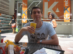 Tim having a drink at the Pans & Company restaurant