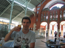 Tim with a drink at a restaurant at the Mercado de Colón market