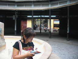 Miaomiao at the fountain at the Plaça Redona square