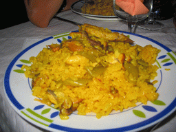 Paella at the terrace of a restaurant in the city center