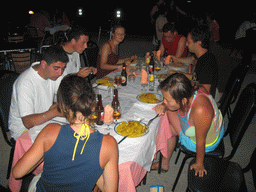 Miaomiao and our friends having paella at the terrace of a restaurant in the city center