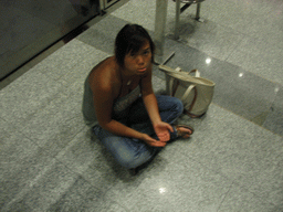Miaomiao playing beggar on a street in the city center