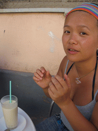 Miaomiao drinking Horchata at the terrace of the Orxateria Joan restaurant