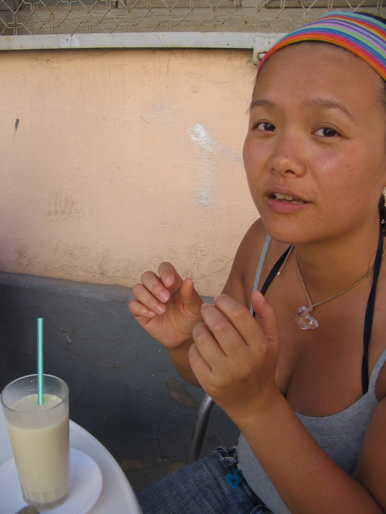 Miaomiao drinking Horchata at the terrace of the Orxateria Joan restaurant