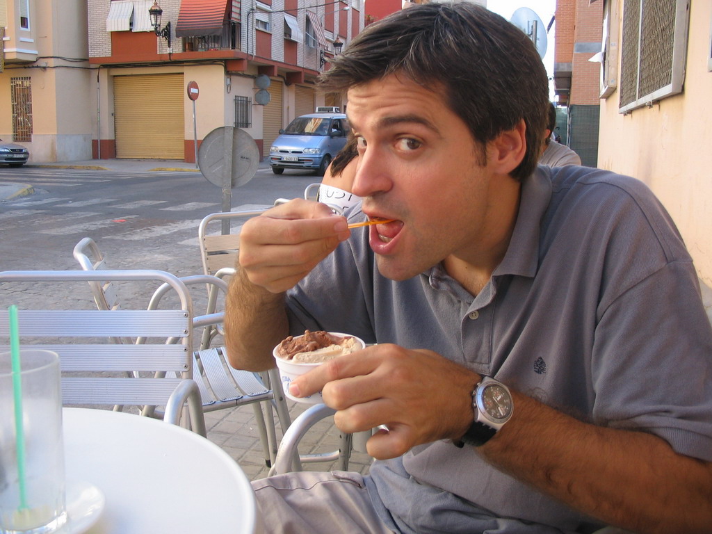 Our friend with an ice cream at the terrace of the Orxateria Joan restaurant