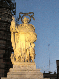 Statue at the Plaça de Tetuan square, at sunset