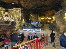 Restaurant, christmas trees and decorations at the christmas market at the Municipal Cave