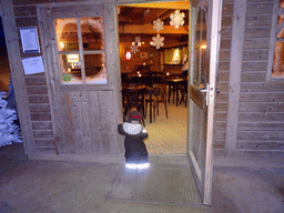Max at the entrance to the chalet at the Winter Wonderland Valkenburg at the Wilhelmina Cave