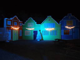 Facades of houses with christmas decorations at the entrance to the Winter Wonderland Valkenburg at the Wilhelmina Cave, by night