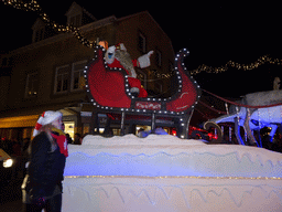 Santa claus at the christmas parade at the Grotestraat Centrum street, by night