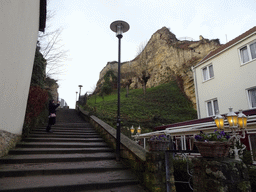 Miaomiao at the staircase at the Van Meijlandstraat street and the ruins of Valkenburg Castle