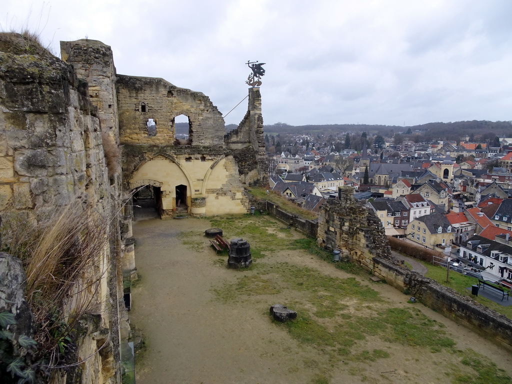 The Knight`s Hall and weather vane at the ruins of Valkenburg Castle, and the town center with the Church of St. Nicolas and St. Barbara and the Geulpoort gate, viewed from the Stair Tower