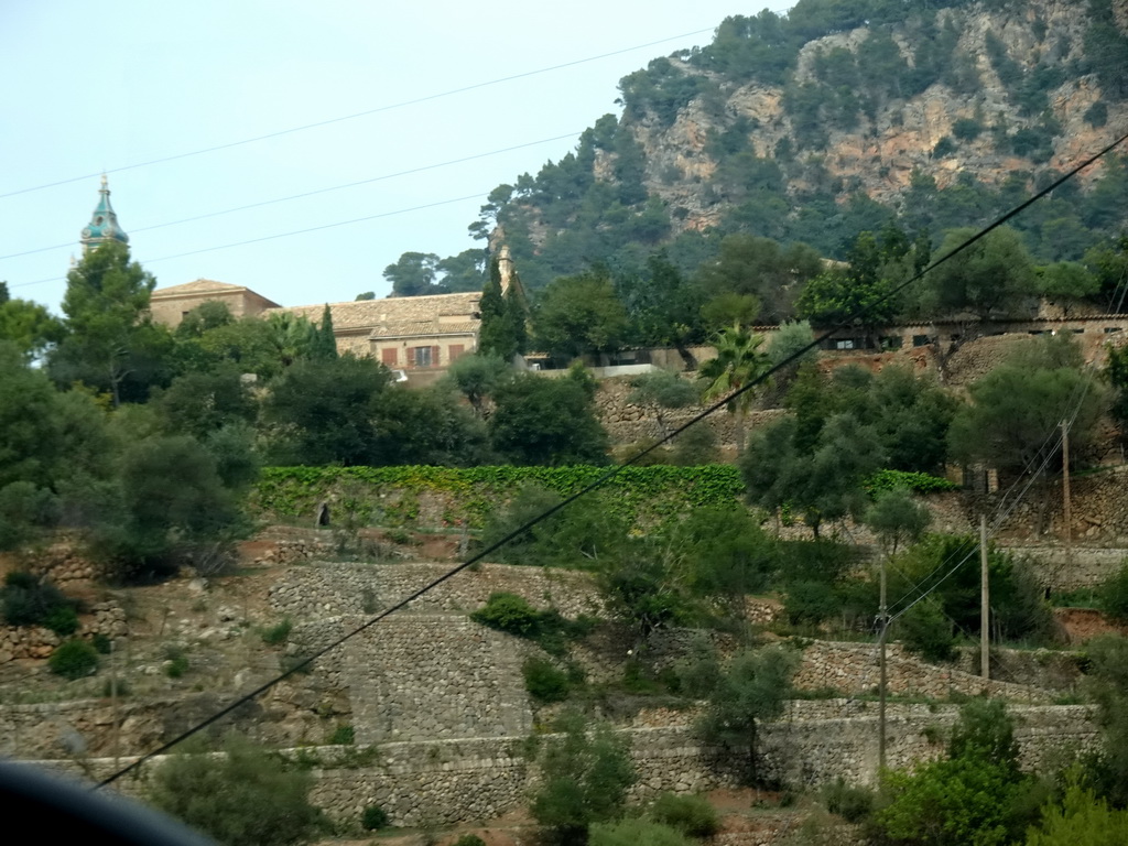 The southeast side of the town center with the tower of the Iglesia dela Cartuja church, viewed from the rental car on the Ma-1110 road