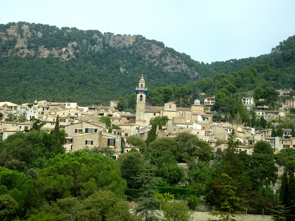 The southeast side of the town center with the tower of the Església de Sant Bartomeu church, viewed from the rental car on the Ma-1110 road