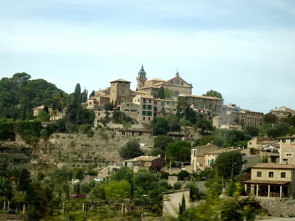 The east side of the town center with the tower of the Iglesia dela Cartuja church, viewed from the rental car on the Ma-1110 road