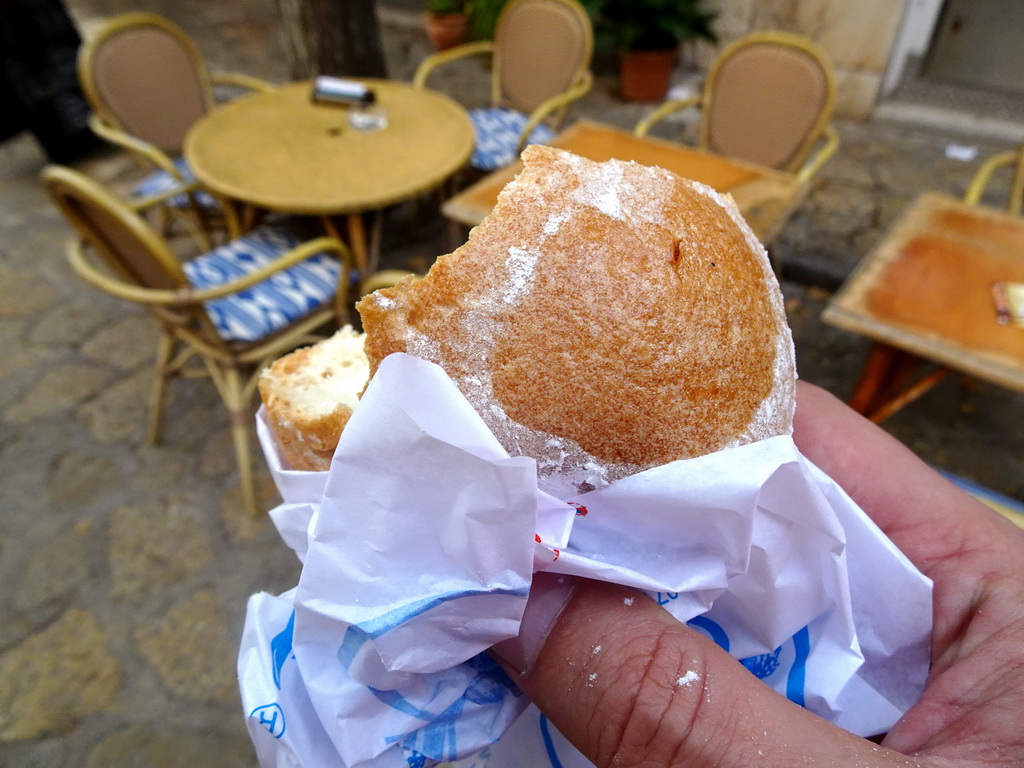 Tim eating a local cake at the Via Blanquerna street