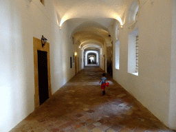 Max with a bucket at the gallery at the Carthusian Monastery Valldemossa museum