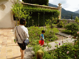 Miaomiao and Max with a bucket at the garden on the southeast side of the Carthusian Monastery Valldemossa museum