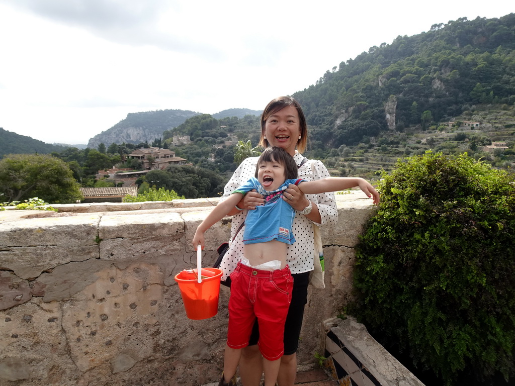 Miaomiao and Max at the garden on the southeast side of the Carthusian Monastery Valldemossa museum, with a view on the south side of the town with Hotel Valldemossa