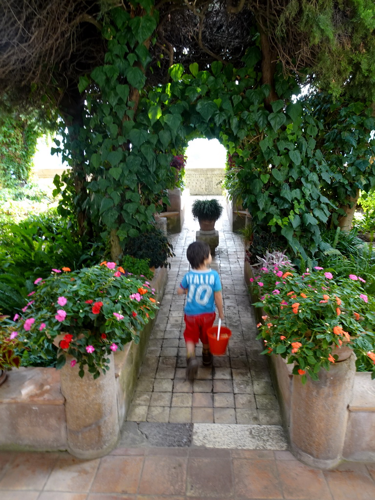 Max with a bucket at the garden of the Museum for Frédéric Chopin and George Sand