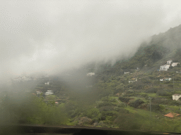 Hills and houses on the west side of town, viewed from the tour bus on the GC-15 road