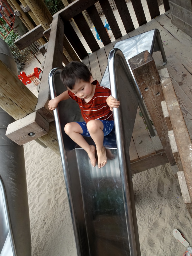 Max on a slide at the playground in the Bamboo Jungle hall at Zoo Veldhoven