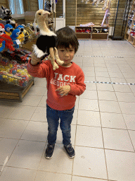 Max with a toy in the souvenir shop of Zoo Veldhoven