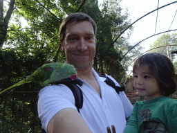 Tim with a Parrot on his shoulder and Max in an Aviary at Zoo Veldhoven