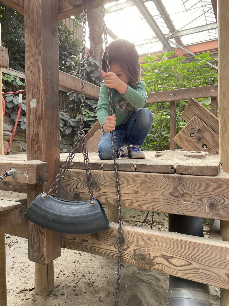 Max playing with sand in the Bamboo Jungle hall at Zoo Veldhoven