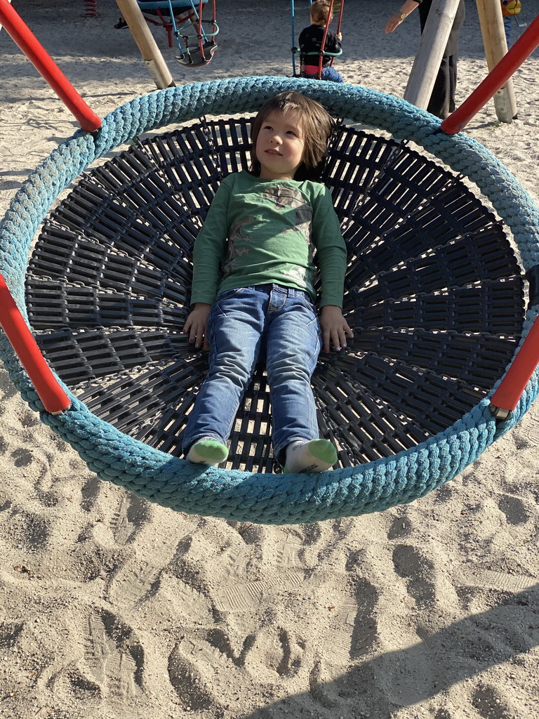 Max on a swing at the large playground at Zoo Veldhoven