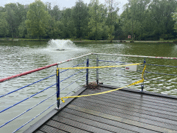 Pond with fountain and a bird`s nest at Zoo Veldhoven