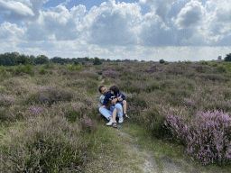 Miaomiao and Max with purple heather on the north side of the Posbank hill